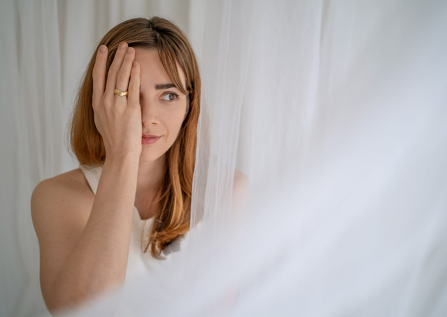 Model showcasing Saint Stone jewelry collection, wearing elegant rings and necklaces, Australian luxury jewelry brand